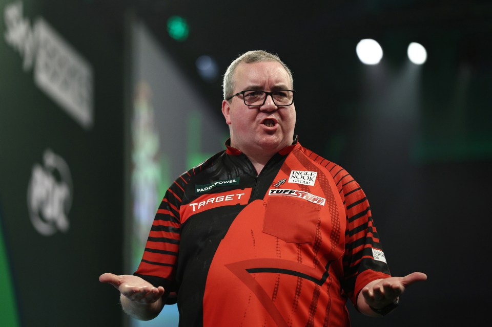 Stephen Bunting of England reacts during a darts match.