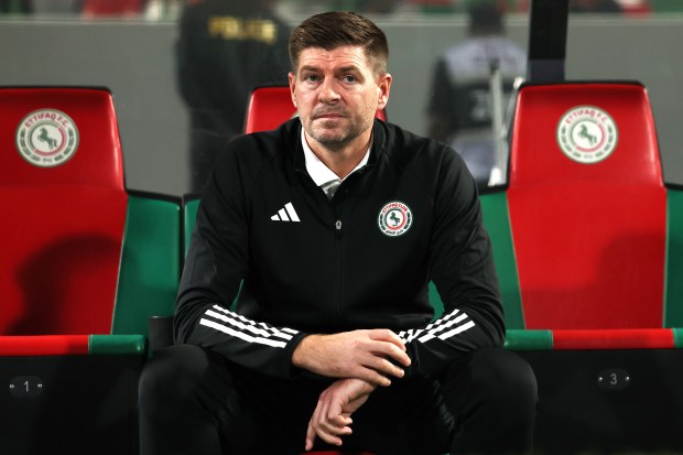 Steven Gerrard, head coach of Al-Ettifaq FC, sitting on the bench.