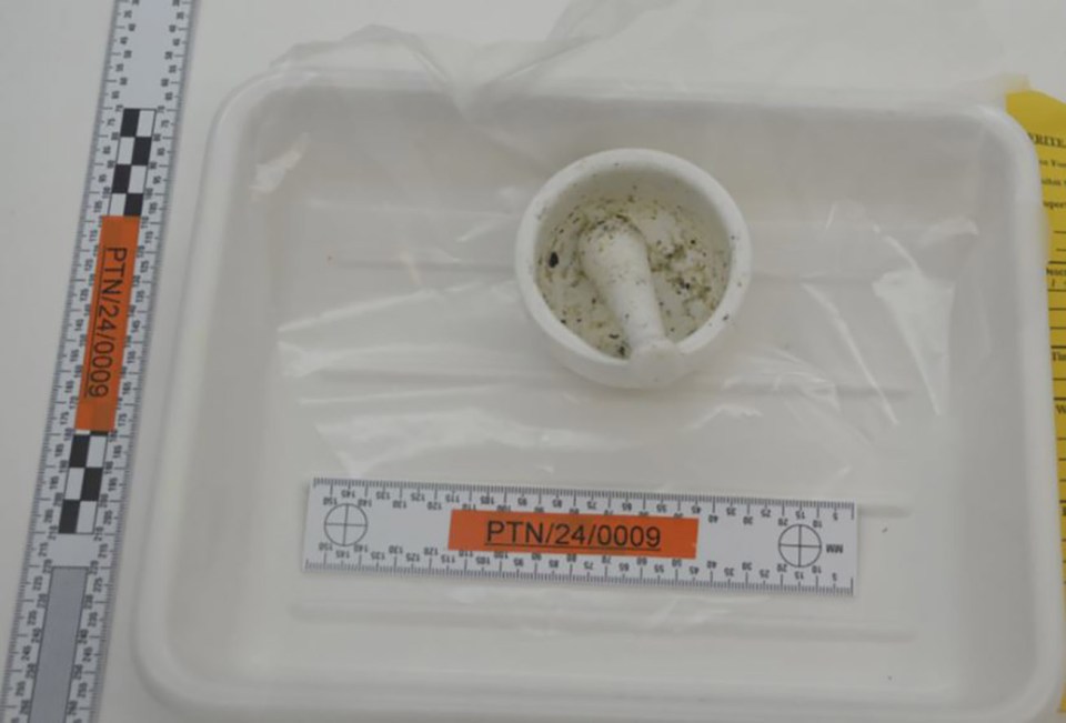 Pestle and mortar with residue in a forensic tray.