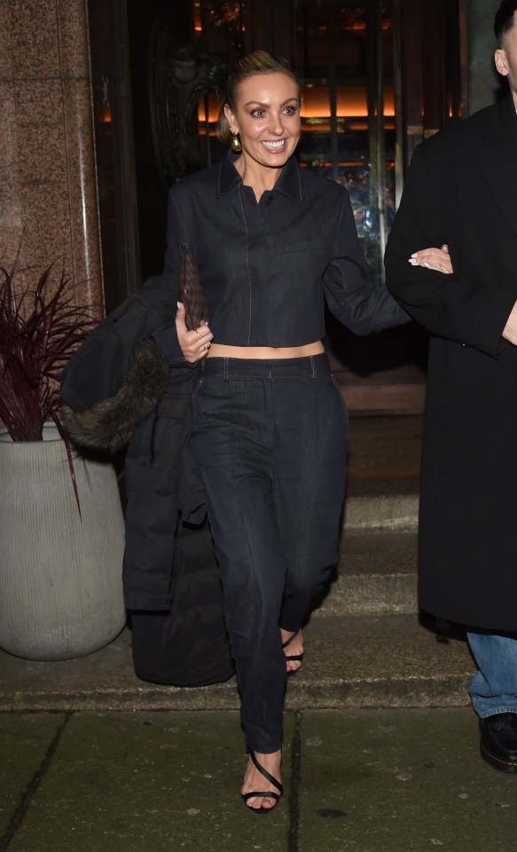 Woman in denim suit leaving a restaurant.