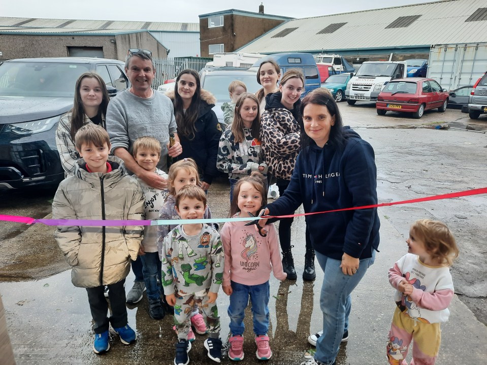 The Radford family cutting a ribbon at a business opening.