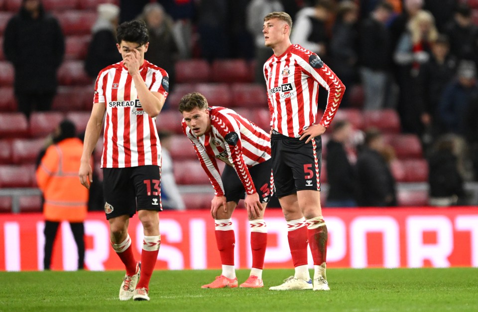 Sunderland soccer players looking dejected on the field.