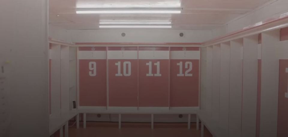 Tamworth FC locker room with numbers 9-12 visible.