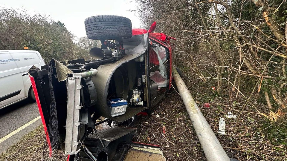 Wreckage of a red Ferrari after a crash.