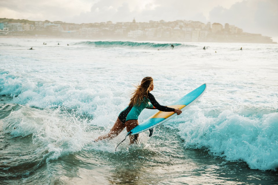 Woman surfing in Australia.