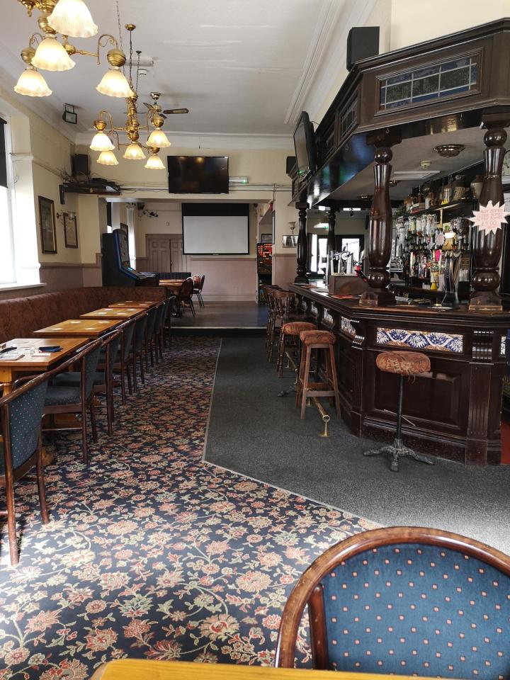 Interior view of the Tadross Hotel in Barry, showing a bar and seating area.