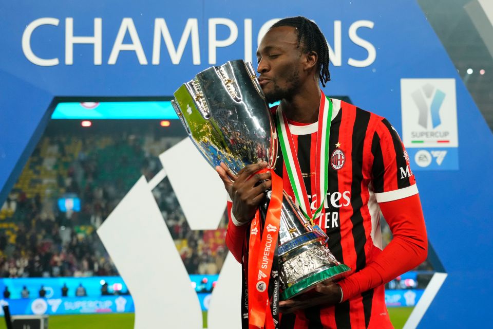 Tammy Abraham of AC Milan kisses the Supercup trophy after his team's victory.