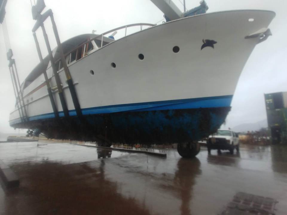 Tangaroa hoisted out of the water for an inspection shortly after Blaine and Janis bought her