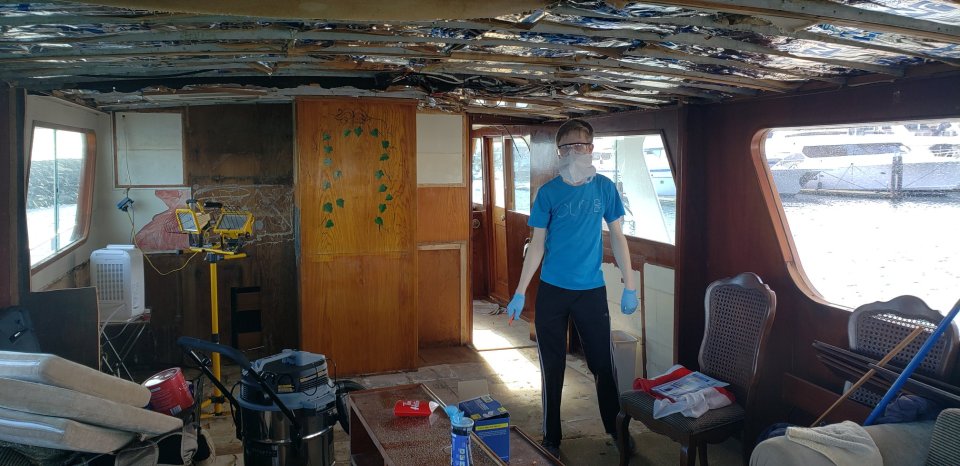 Son Josh, 21, helping to take apart the galley