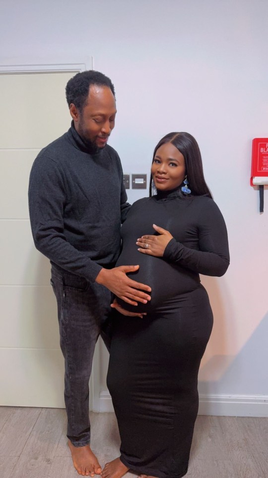 A pregnant woman and her husband.