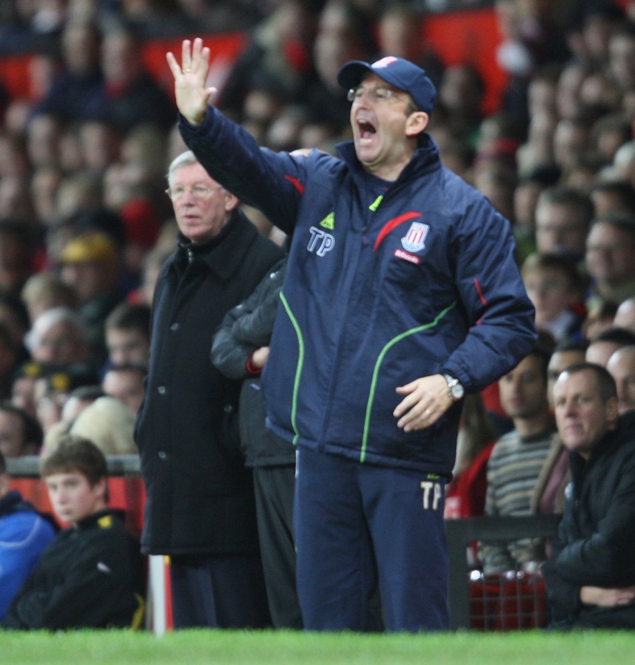 Tony Pulis, Stoke City manager, shouts instructions from the dugout.