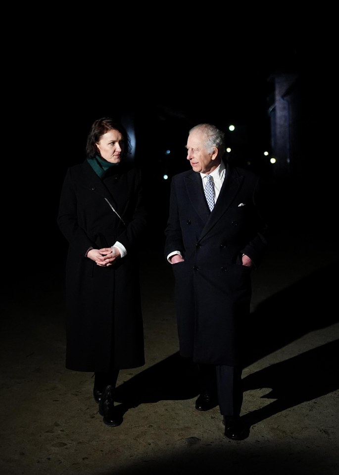 King Charles III touring Auschwitz-Birkenau.