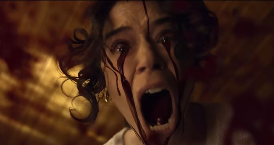 A bloody, screaming woman from the trailer for Stephen King's excessively violent movie.