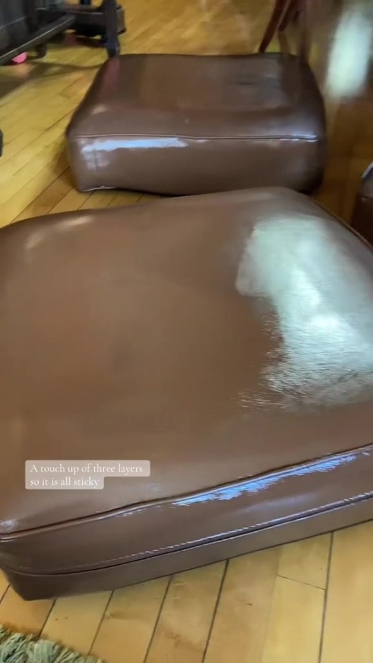 Brown sofa cushions being restored with three layers of paint; one cushion is partially painted.