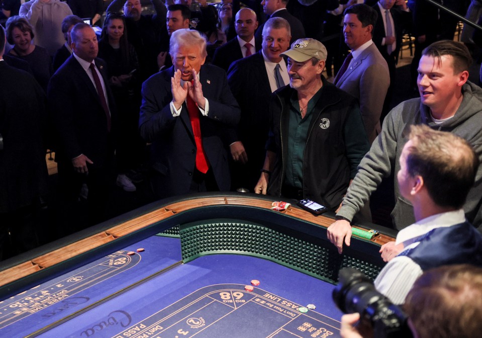 Donald Trump speaking at a casino craps table.