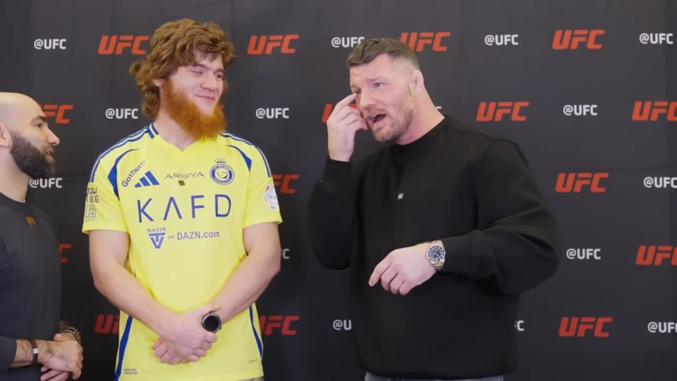 Michael Bisping and a fighter at a UFC press conference.