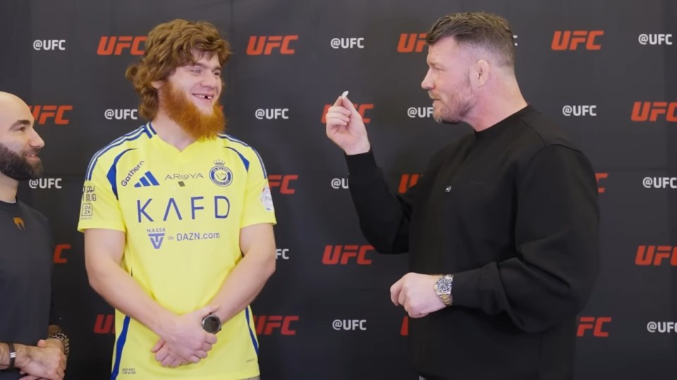 Michael Bisping and a UFC fighter at a press conference.