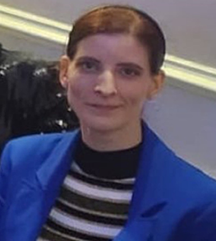 Photo of Eliza Huszti, wearing a blue jacket and striped shirt.