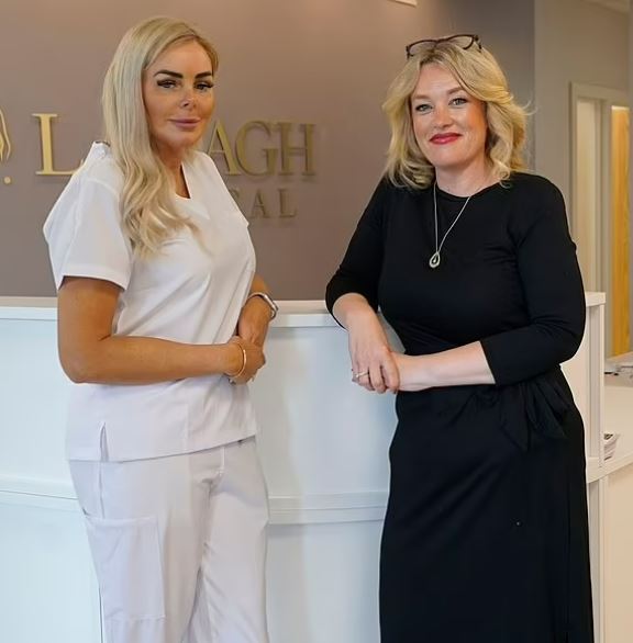 Two women standing in a medical office.