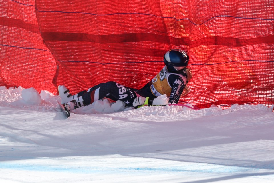 Lindsey Vonn lying in the snow after a skiing crash.