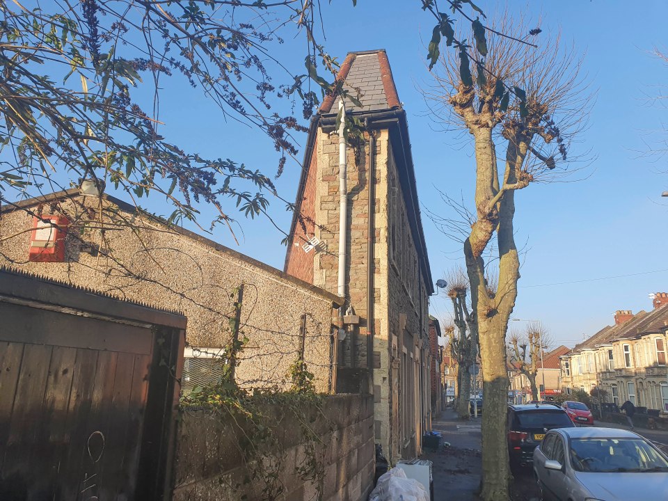 Unusually shaped house on a residential street.