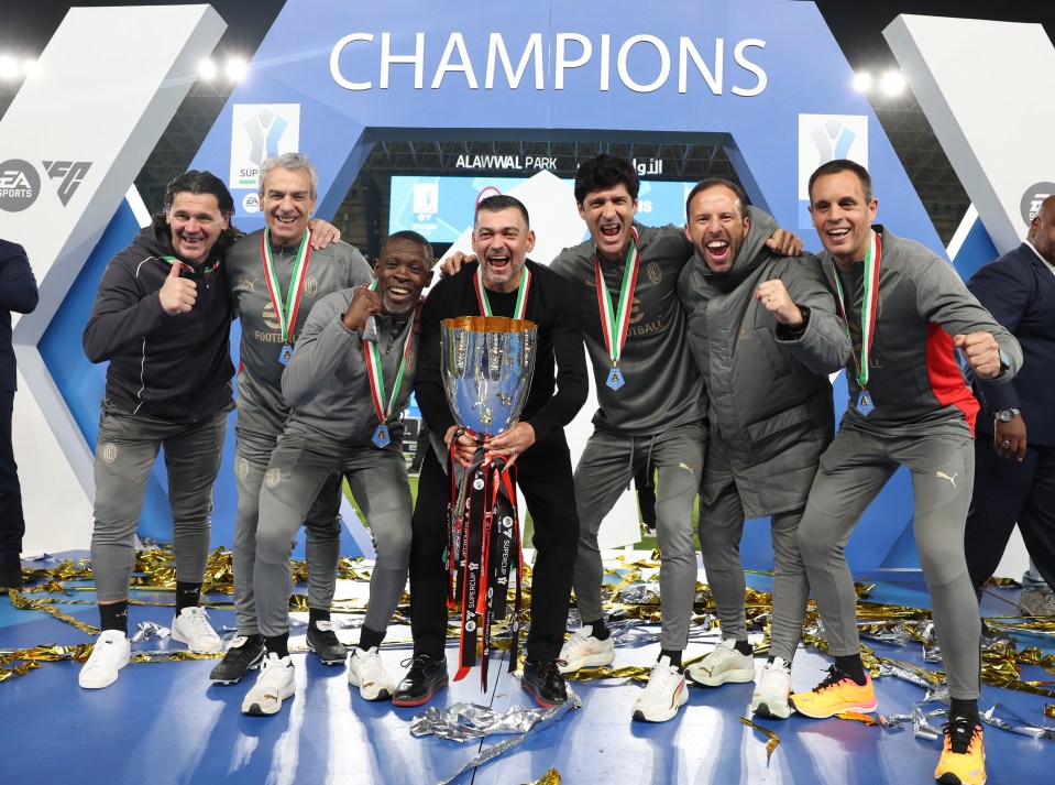 Sergio Conceicao celebrates winning the Supercoppa Italiana with his backroom staff