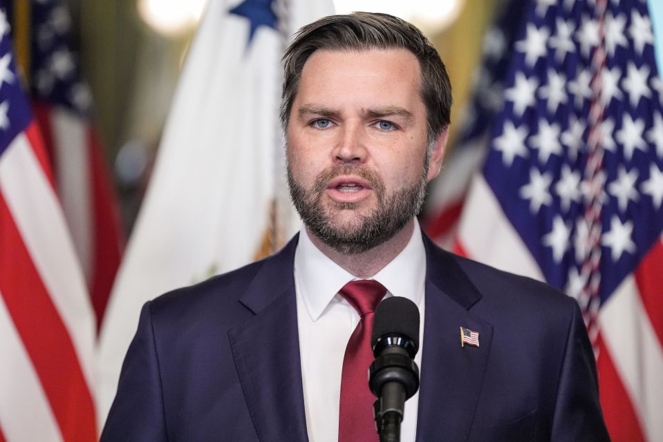 Vice President JD Vance speaking at a podium.