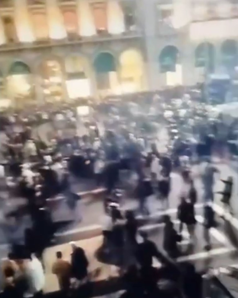 Video of a large crowd celebrating New Year's Eve in Milan.