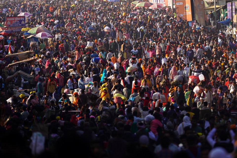 Large crowd of Hindu pilgrims at the Maha Kumbh Mela festival.