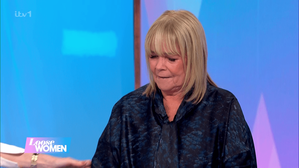 Screenshot of a woman appearing emotional on Loose Women.