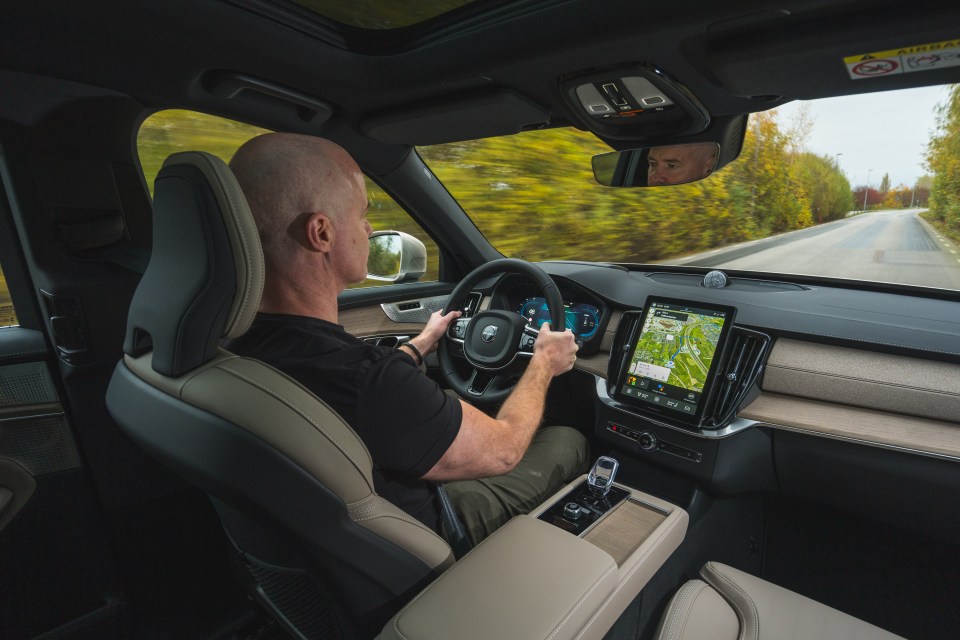 Man driving a Volvo XC90.