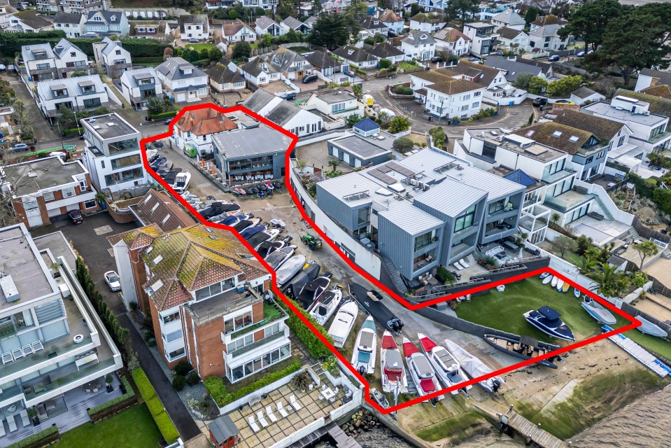 Aerial view of a proposed development site in Sandbanks, outlining new luxury flats and a restaurant near a boatyard.