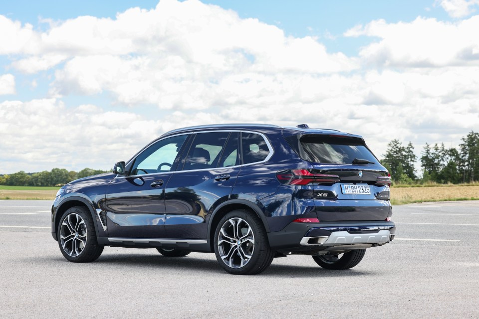 Rear view of a dark blue BMW X5.