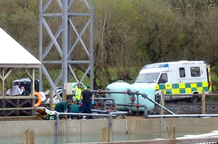 Emergency responders attending to a person at a theme park.