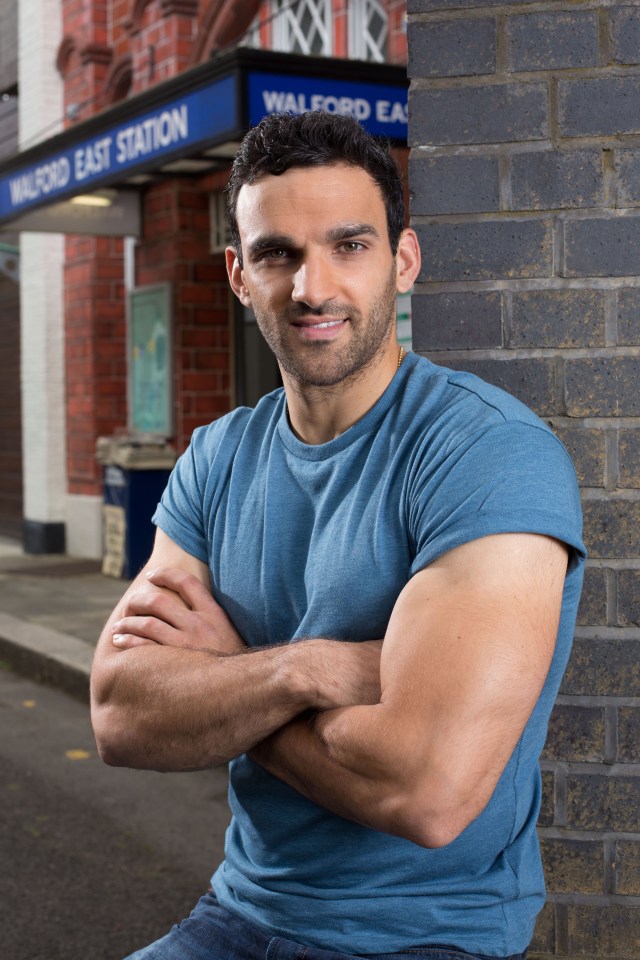 Portrait of Davood Ghadami with arms crossed.