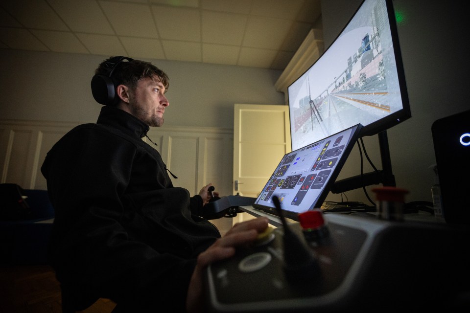 A train driver apprentice using a simulator.