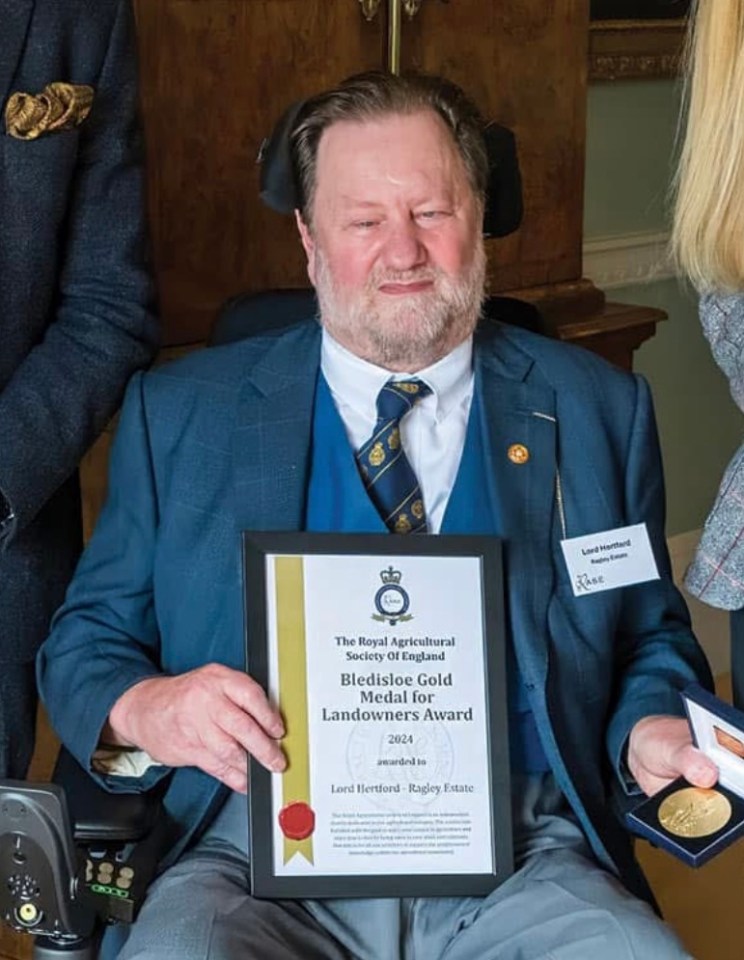 Lord Hertford holding the Bledisloe Gold Medal for Landowners Award.