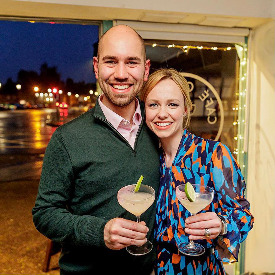 William and Kelsey Seymour, Lord and Lady Yarmouth, holding cocktails.