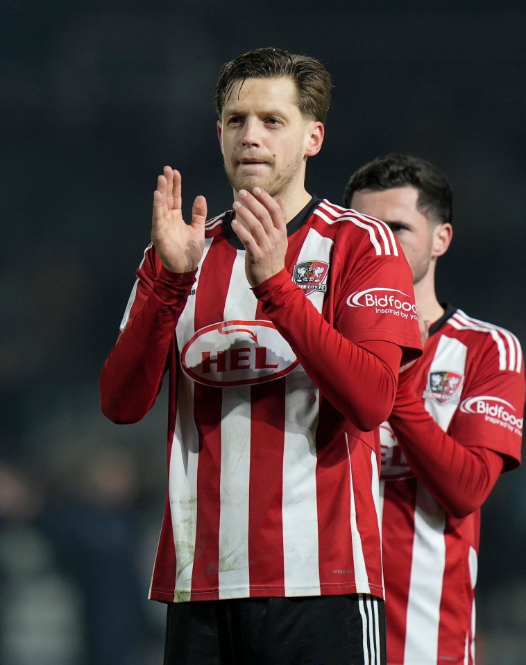 Jack Fitzwater of Exeter City applauding fans.