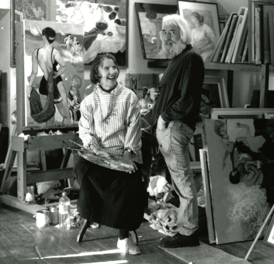 Black and white photo of two artists in their studio.