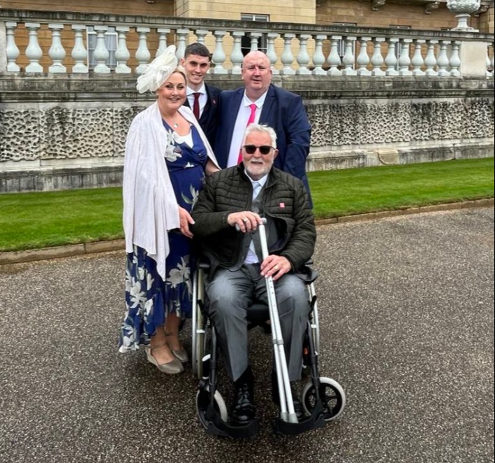 Family portrait in front of Buckingham Palace.