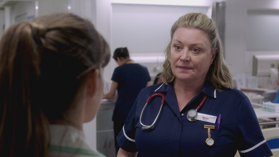 Screenshot of a nurse speaking to a patient.