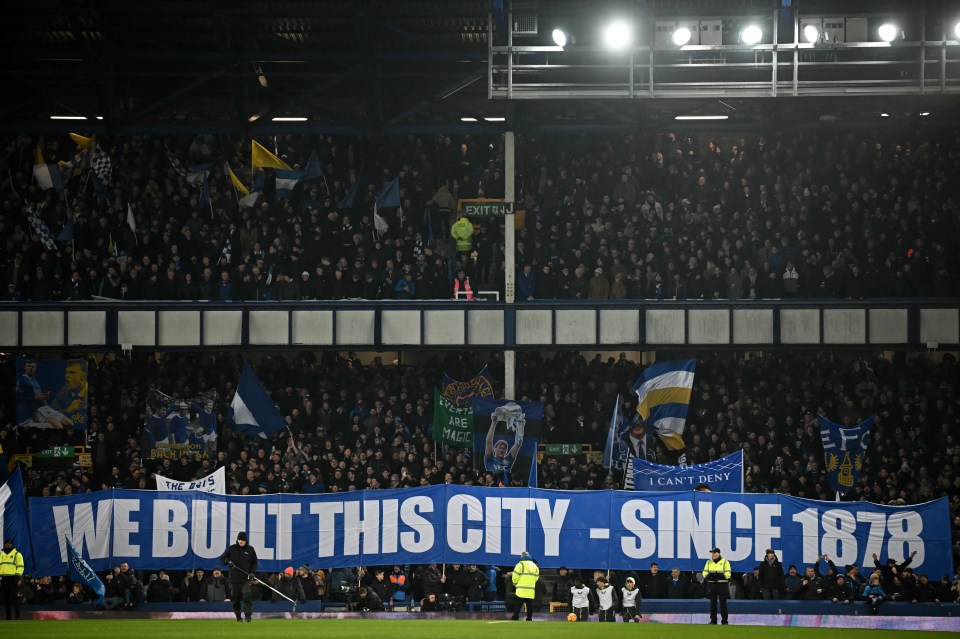 Everton fans display a banner reading "We Built This City - Since 1878" at a football match.