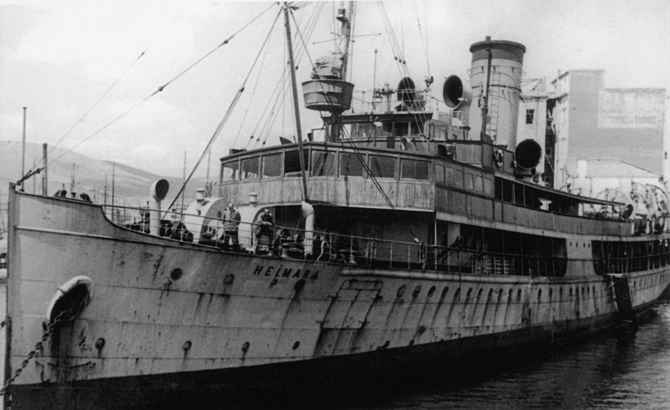 Black and white photo of the Heimara ship docked in Piraeus.