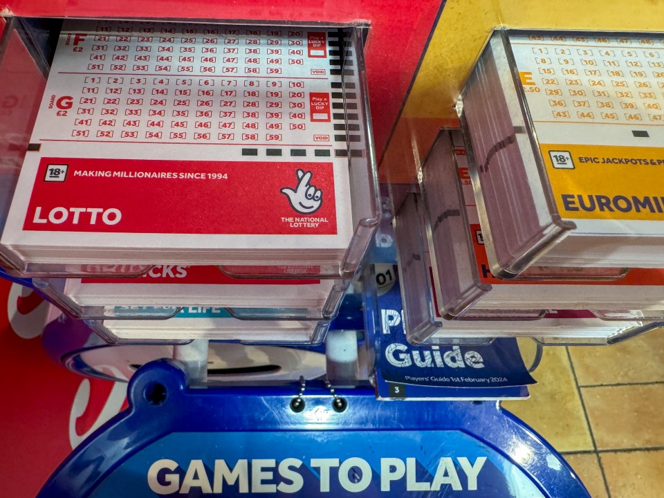 National Lottery tickets in a display stand.