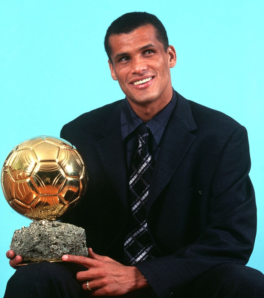 Rivaldo holding the Ballon d'Or trophy.