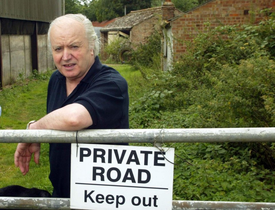 Tony Martin, a farmer, standing by a private road sign.