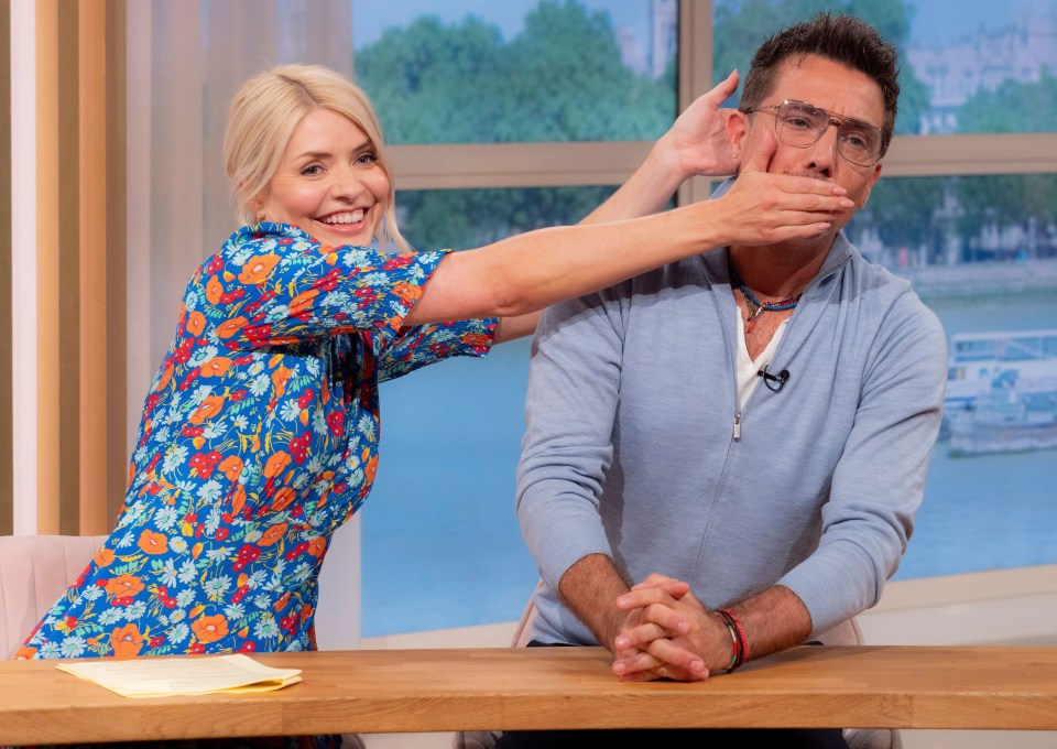 Holly Willoughby playfully covers Gino D'Acampo's mouth on This Morning.