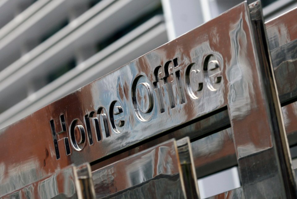 Close-up of a metallic sign reading "Home Office."