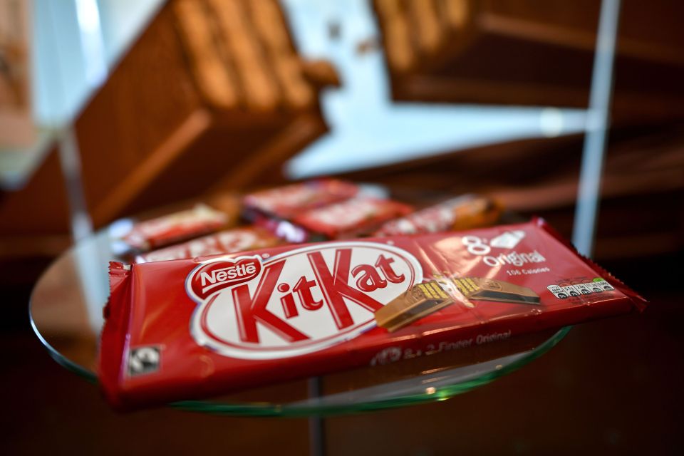 KitKat chocolate bar on a glass surface.